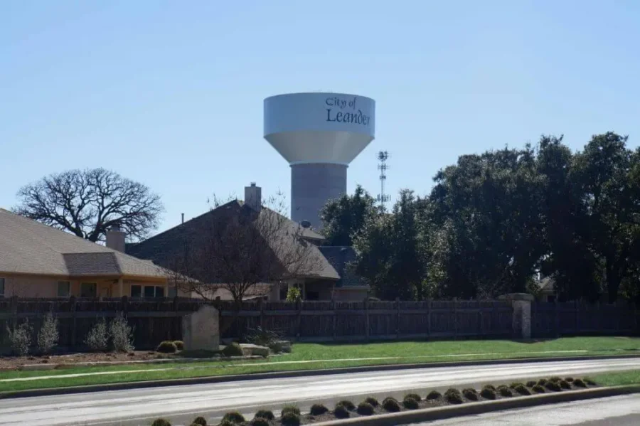 Leander water tower behind homes